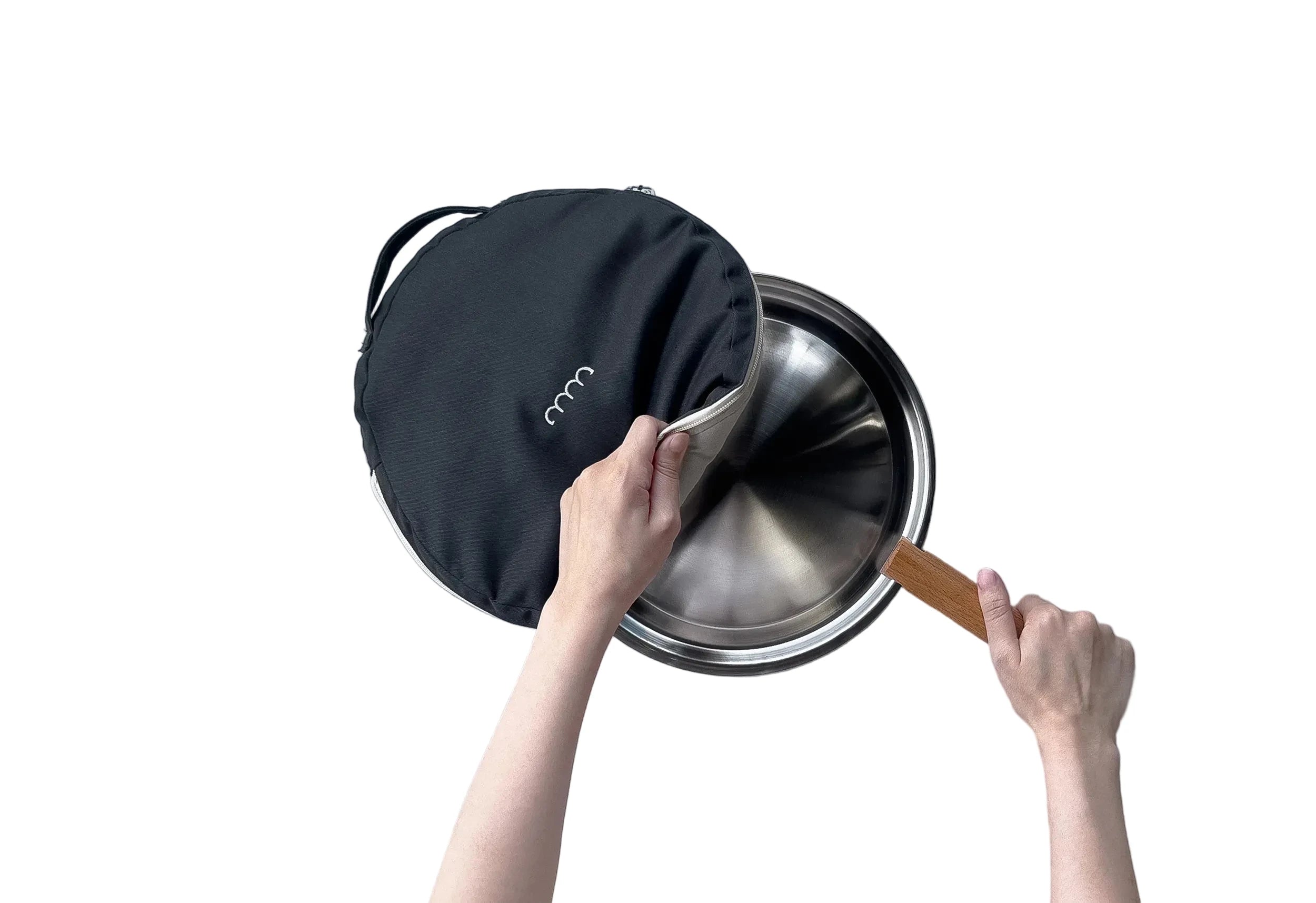 Person opening a black carrying case to reveal a metal pot on a gray background